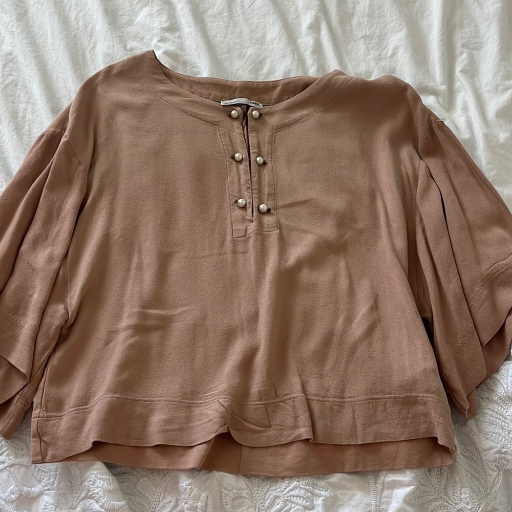 zara super stylish blouse with pearl button details